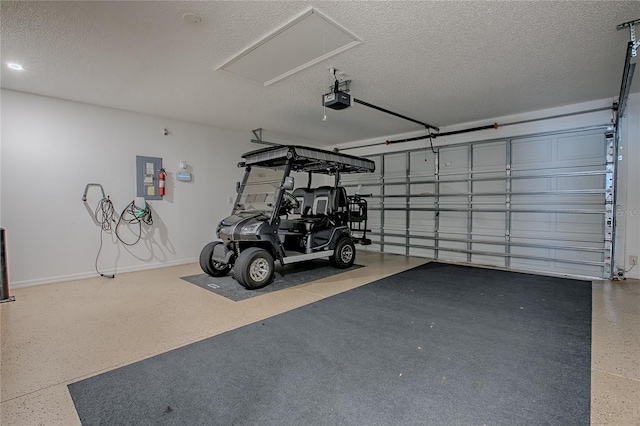 17009 SE 96th Chapelwood Cir, The Villages, FL 32162 - garage with a garage door opener and baseboards