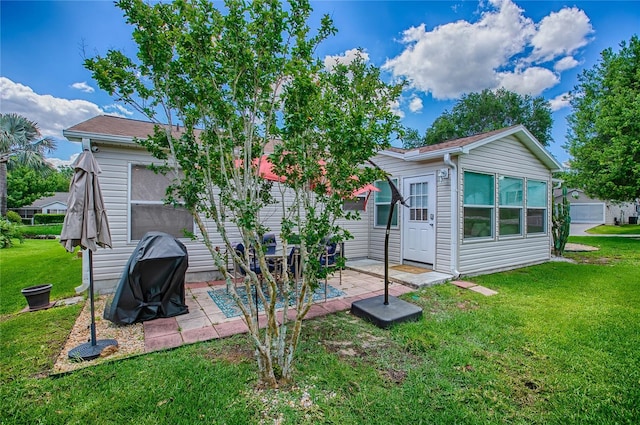 17009 SE 96th Chapelwood Cir, The Villages, FL 32162 - rear view of house featuring a yard and a patio area