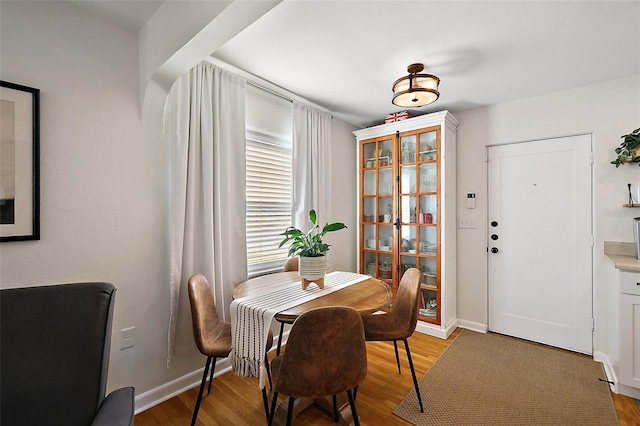 30 E Key Ave, Eustis, FL 32726 - dining room featuring light wood-style floors and baseboards