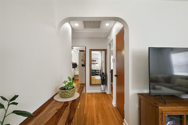 30 E Key Ave, Eustis, FL 32726 - hallway featuring light wood-type flooring, arched walkways, and recessed lighting