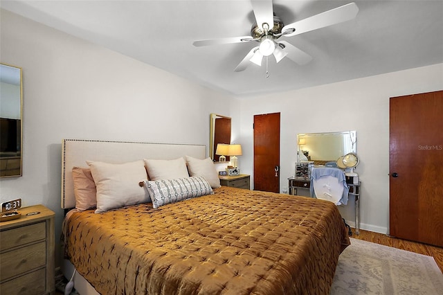 30 E Key Ave, Eustis, FL 32726 - bedroom featuring wood finished floors, ceiling fan, and baseboards