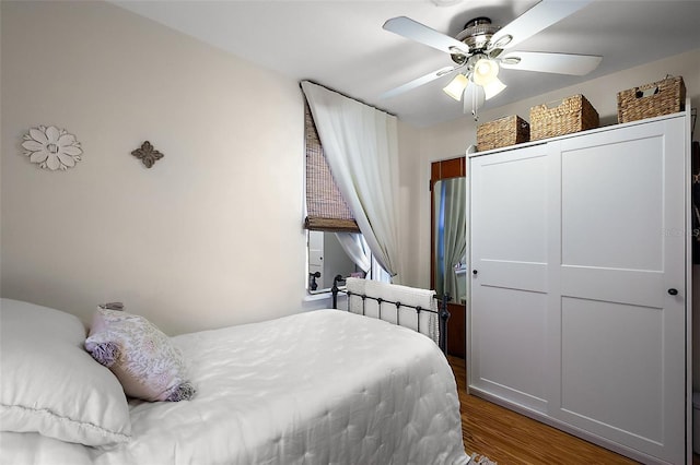 30 E Key Ave, Eustis, FL 32726 - bedroom with wood finished floors and a ceiling fan