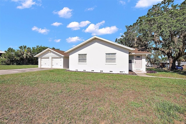 30 E Key Ave, Eustis, FL 32726 - view of side of property with driveway, a lawn, stucco siding, a garage, and crawl space