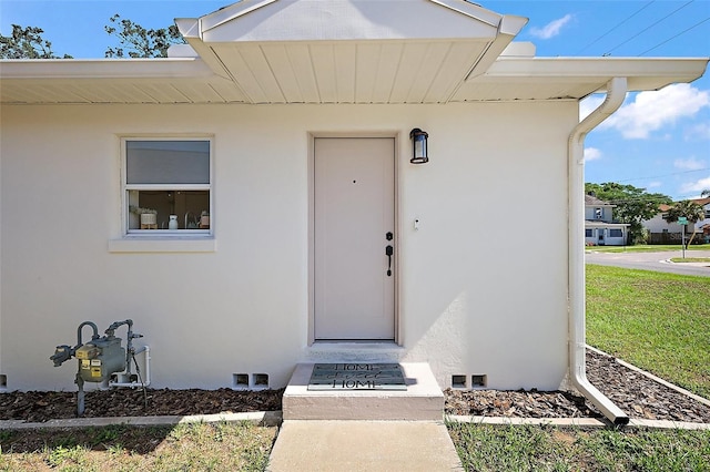 30 E Key Ave, Eustis, FL 32726 - doorway to property featuring stucco siding
