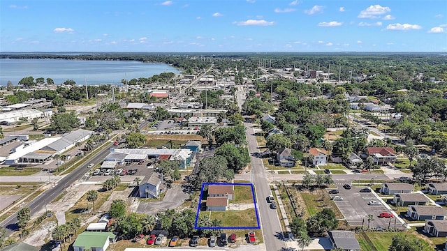 30 E Key Ave, Eustis, FL 32726 - aerial view of property and surrounding area with property boundaries highlighted and a large body of water