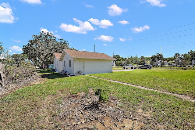 30 E Key Ave, Eustis, FL 32726 - view of property exterior with a yard