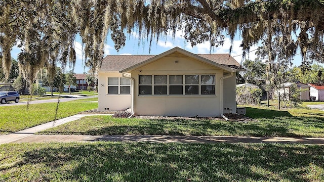 30 E Key Ave, Eustis, FL 32726 - view of front of property with a front yard and stucco siding