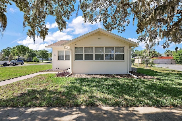 30 E Key Ave, Eustis, FL 32726 - view of front of property featuring a front lawn and stucco siding