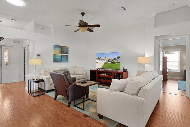541 Carrera Dr, The Villages, FL 32159 - living area with ornamental molding, ceiling fan, wood-type flooring, and baseboards