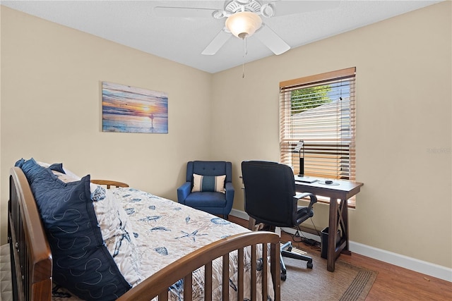 541 Carrera Dr, The Villages, FL 32159 - bedroom with wood finished floors, baseboards, and a ceiling fan