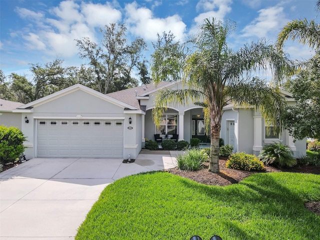 4581 Shenandoah River Trl, Leesburg, FL 34748 - ranch-style home with stucco siding, an attached garage, driveway, and a front lawn