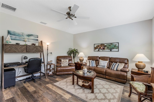 4581 Shenandoah River Trl, Leesburg, FL 34748 - living area featuring dark wood-style floors, a desk, and ceiling fan