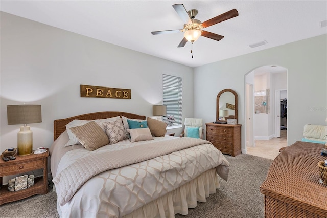 4581 Shenandoah River Trl, Leesburg, FL 34748 - carpeted bedroom featuring arched walkways and ceiling fan