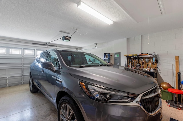 4581 Shenandoah River Trl, Leesburg, FL 34748 - garage with electric panel, concrete block wall, and a garage door opener