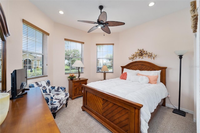 bedroom with light carpet, recessed lighting, ceiling fan, and baseboards
