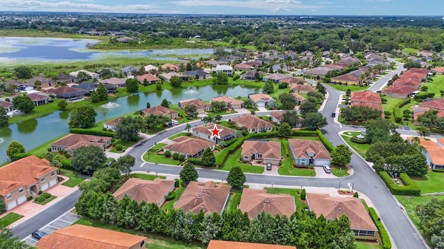 aerial view of residential area featuring a nearby body of water