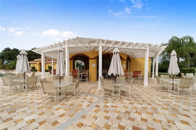 view of patio / terrace with outdoor dining area and a pergola