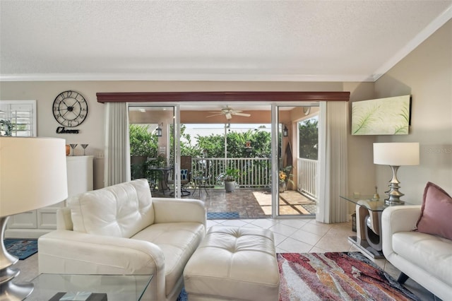 17108 SE 76th Creekside Cir, The Villages, FL 32162 - living room featuring a textured ceiling, crown molding, a ceiling fan, and light tile patterned floors