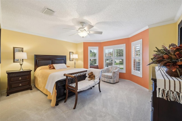 17108 SE 76th Creekside Cir, The Villages, FL 32162 - bedroom with light carpet, crown molding, a textured ceiling, baseboards, and a ceiling fan