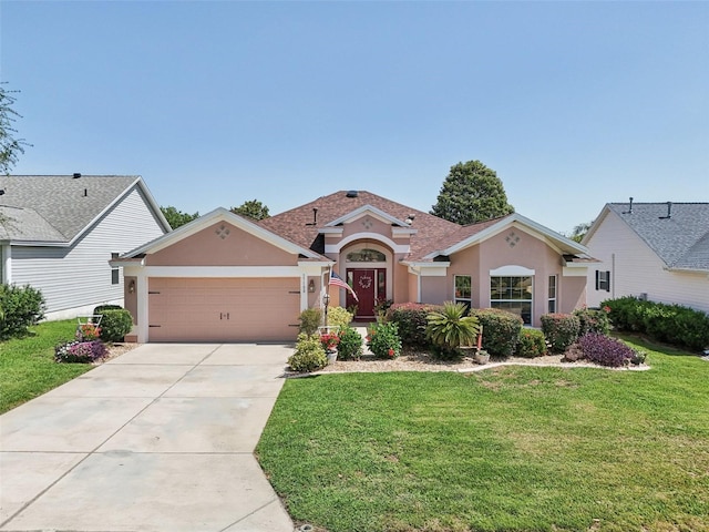 17108 SE 76th Creekside Cir, The Villages, FL 32162 - mediterranean / spanish home with stucco siding, a garage, concrete driveway, and a front lawn