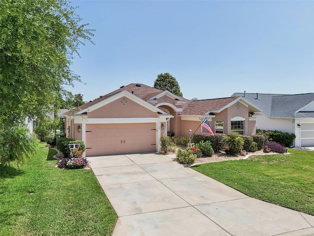 17108 SE 76th Creekside Cir, The Villages, FL 32162 - view of front of house with stucco siding, an attached garage, concrete driveway, and a front lawn