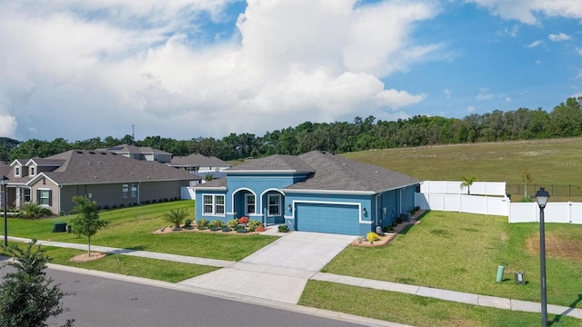view of front of property with a garage, driveway, and stucco siding