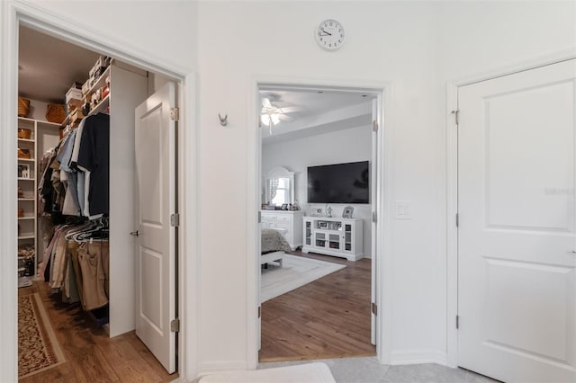 corridor with wood finished floors