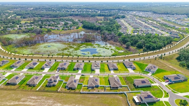 aerial overview of property's location featuring a large body of water and nearby suburban area