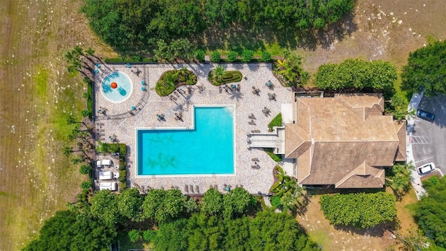 view of property location with a pool