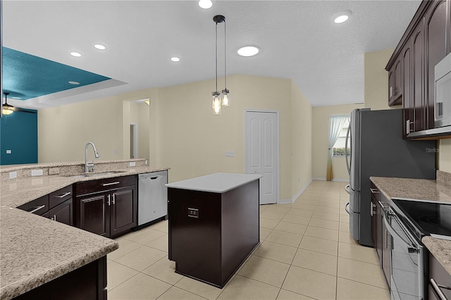 2424 Plumadore Dr, Grand Island, FL 32735 - kitchen featuring dishwasher, a sink, a kitchen island, light tile patterned floors, and pendant lighting