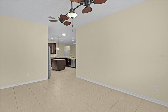 2424 Plumadore Dr, Grand Island, FL 32735 - unfurnished living room featuring a ceiling fan, baseboards, and recessed lighting