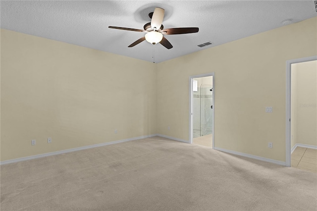 2424 Plumadore Dr, Grand Island, FL 32735 - unfurnished room featuring a ceiling fan, light carpet, a textured ceiling, baseboards, and a smoke detector