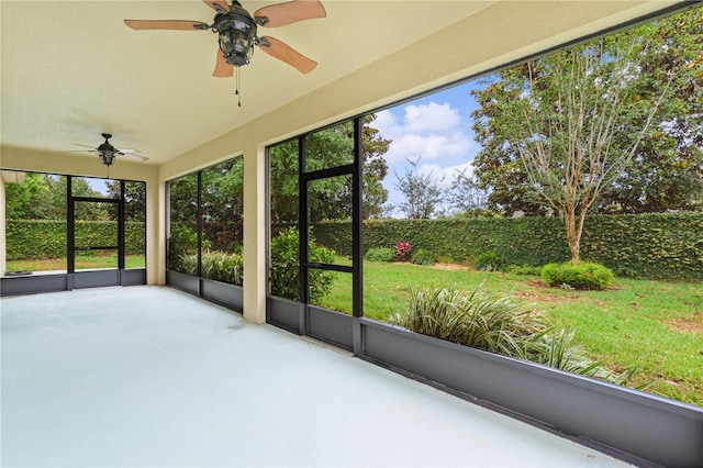 2424 Plumadore Dr, Grand Island, FL 32735 - unfurnished sunroom with a ceiling fan and plenty of natural light