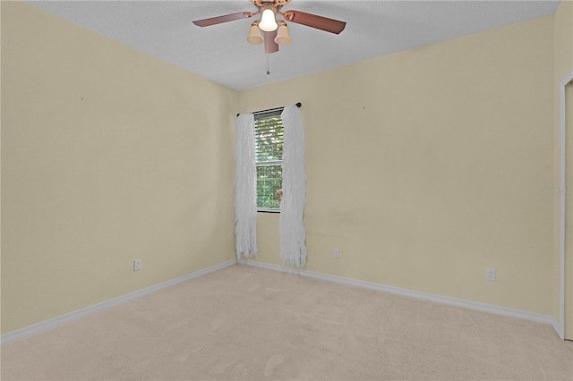 2424 Plumadore Dr, Grand Island, FL 32735 - unfurnished room featuring light carpet, ceiling fan, baseboards, and a textured ceiling