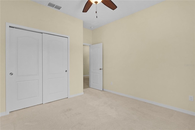2424 Plumadore Dr, Grand Island, FL 32735 - unfurnished bedroom featuring carpet flooring, baseboards, a closet, and ceiling fan