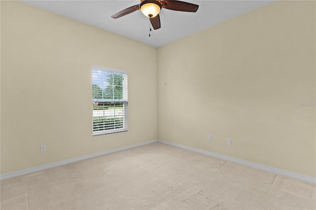 2424 Plumadore Dr, Grand Island, FL 32735 - unfurnished room with a ceiling fan, light colored carpet, and baseboards
