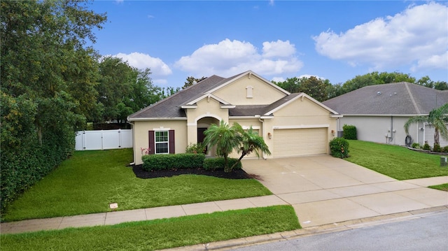 2424 Plumadore Dr, Grand Island, FL 32735 - view of front facade with stucco siding, an attached garage, concrete driveway, and a gate