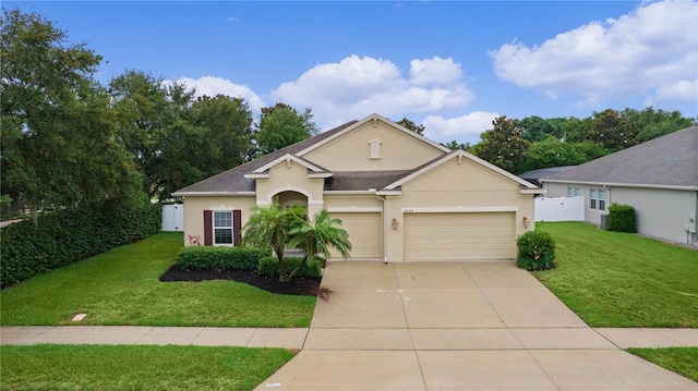 2424 Plumadore Dr, Grand Island, FL 32735 - view of front facade with stucco siding, a garage, and concrete driveway