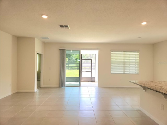 6203 SW 93rd Loop, Ocala, FL 34476 - unfurnished room with recessed lighting, light tile patterned floors, baseboards, and a textured ceiling