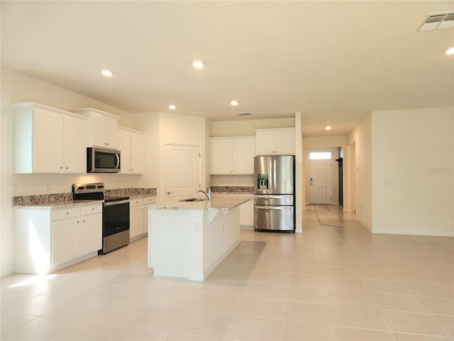 6203 SW 93rd Loop, Ocala, FL 34476 - kitchen featuring stainless steel appliances, a sink, recessed lighting, a center island with sink, and white cabinetry