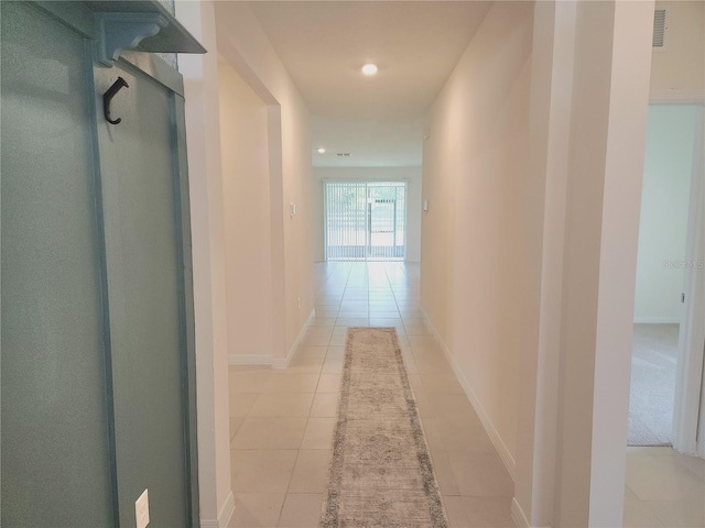 6203 SW 93rd Loop, Ocala, FL 34476 - hallway with light tile patterned floors, recessed lighting, and baseboards