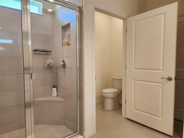 6203 SW 93rd Loop, Ocala, FL 34476 - bathroom with a shower stall, toilet, tile patterned flooring, and baseboards