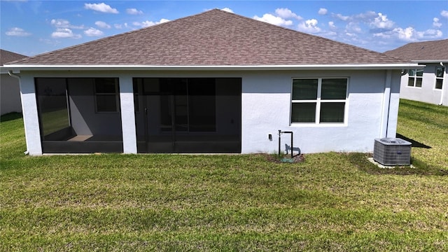 6203 SW 93rd Loop, Ocala, FL 34476 - rear view of property featuring a shingled roof, a lawn, a sunroom, and stucco siding
