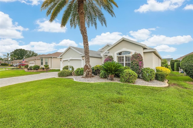1521 Southport St, The Villages, FL 32162 - single story home featuring a garage, stucco siding, driveway, and a front yard