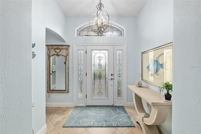 1521 Southport St, The Villages, FL 32162 - tiled entryway with a chandelier and baseboards