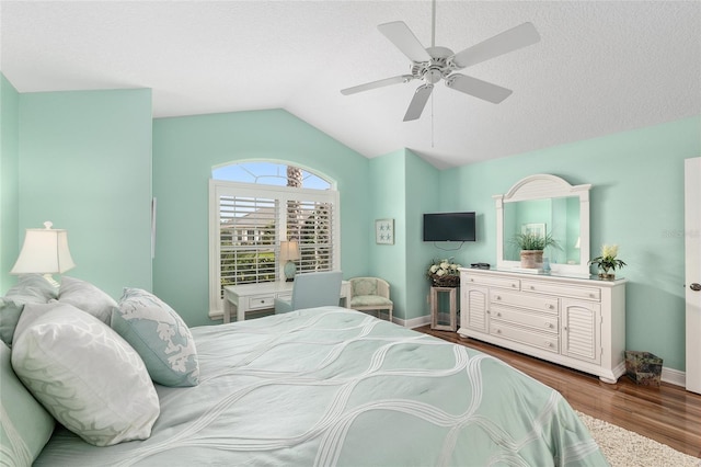 1521 Southport St, The Villages, FL 32162 - bedroom with vaulted ceiling, wood finished floors, baseboards, and a ceiling fan
