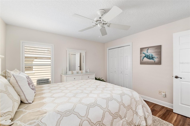 1521 Southport St, The Villages, FL 32162 - bedroom featuring baseboards, dark wood-style flooring, a closet, and ceiling fan