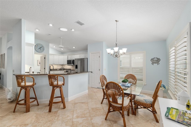 1521 Southport St, The Villages, FL 32162 - dining room featuring a chandelier, lofted ceiling, a textured ceiling, recessed lighting, and a ceiling fan