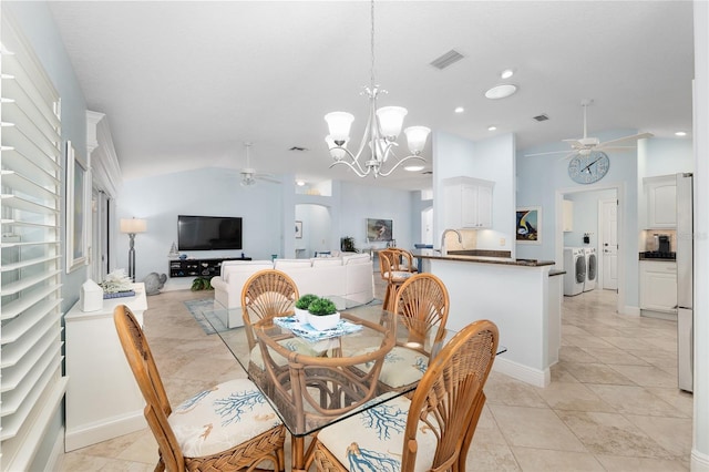 1521 Southport St, The Villages, FL 32162 - dining space featuring ceiling fan, a chandelier, lofted ceiling, recessed lighting, and separate washer and dryer