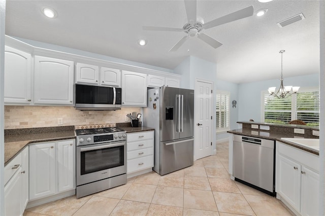1521 Southport St, The Villages, FL 32162 - kitchen featuring appliances with stainless steel finishes, backsplash, white cabinetry, a ceiling fan, and recessed lighting